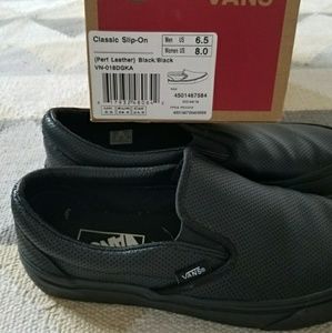 Black Vans slip ons